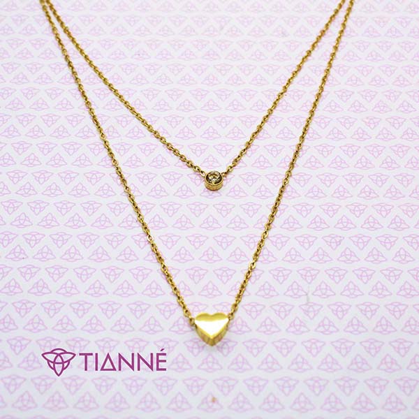 Collar doble en acero dorado con dije de corazón y cristal